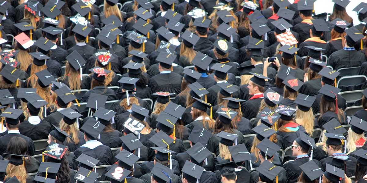 aerial view of a large group of graduates wearing caps